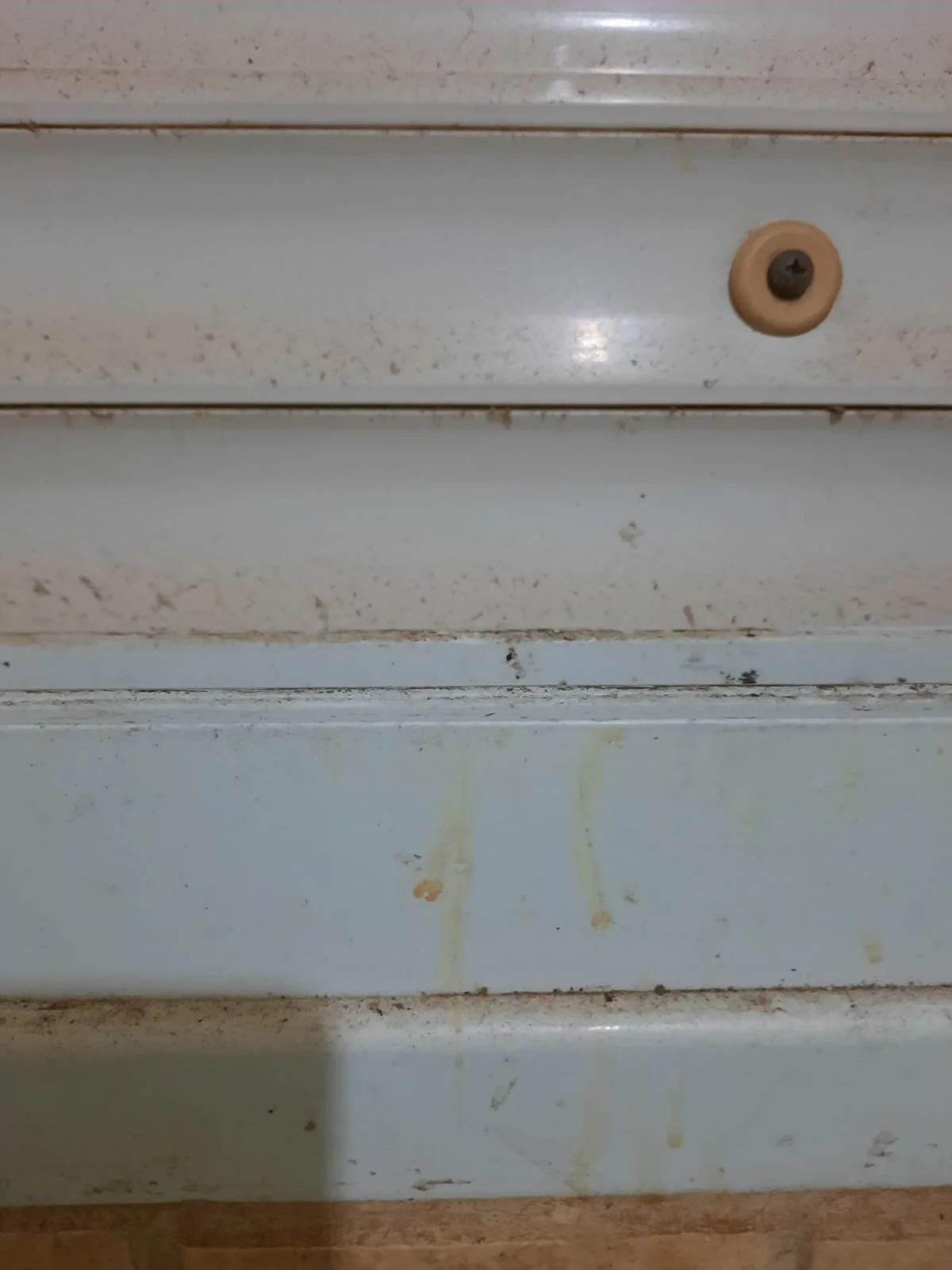 Window shutter track before cleaning